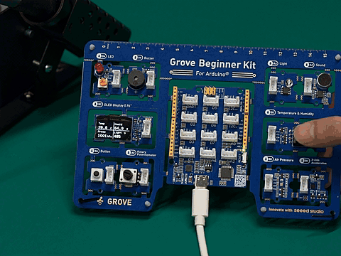Grove Beginner Kit displaying weather station data on its OLED screen