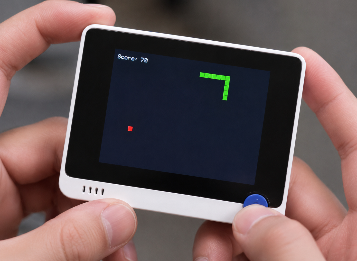 Snake game running on a handheld Wio Terminal display